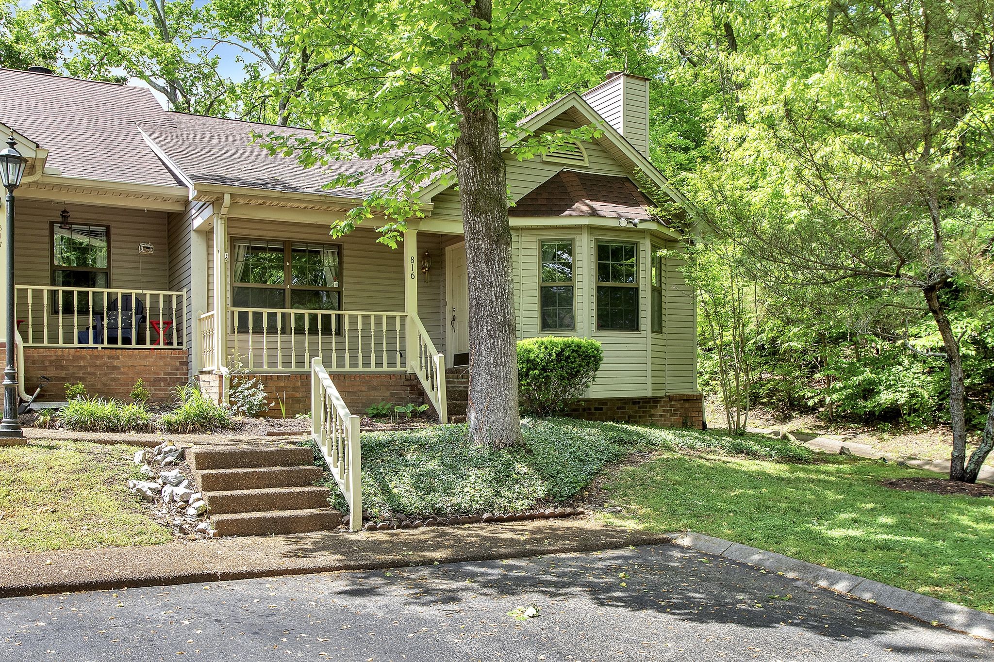 816 Beazer Lane Antioch, TN 37013 - Photo 2 of 32 a front view of a house with a garden