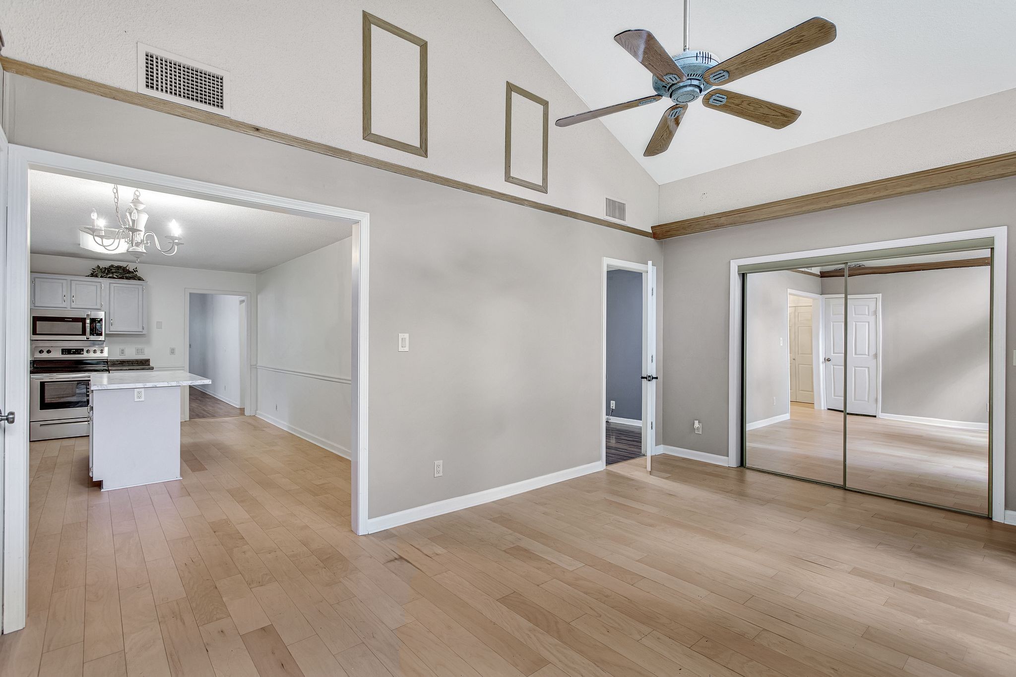 816 Beazer Lane Antioch, TN 37013 - Photo 21 of 32 a view of a kitchen with wooden floor and a ceiling fan