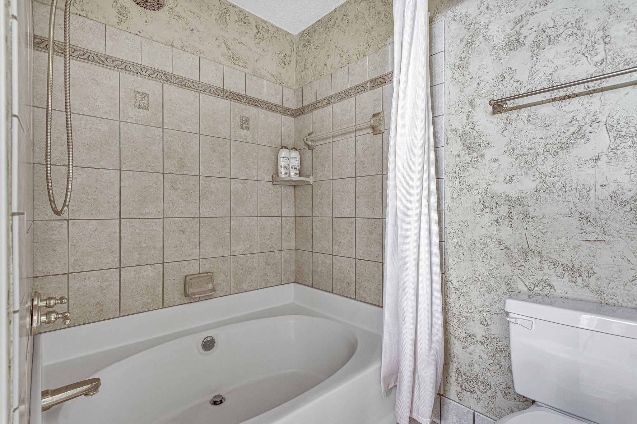 816 Beazer Lane Antioch, TN 37013 - Photo 28 of 32 a bathroom with a bathtub and a shower