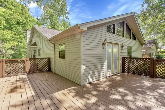 a view of backyard with a large tree