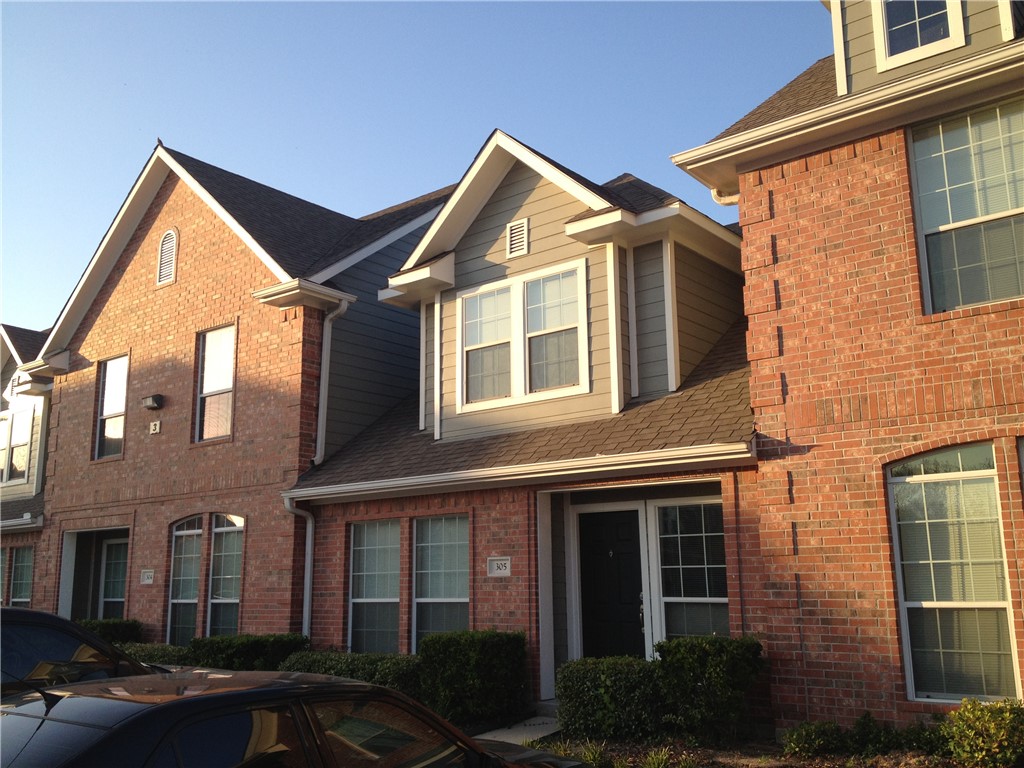 a front view of a house with yard