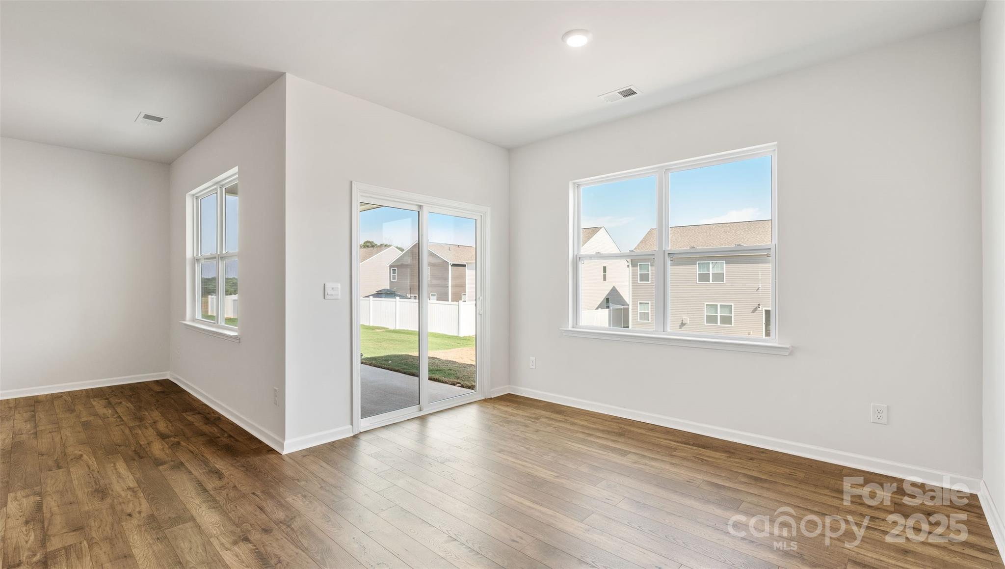 119 Bovine Br Road Fletcher, NC 28732 - Photo 13 of 29 an empty room with wooden floor and windows