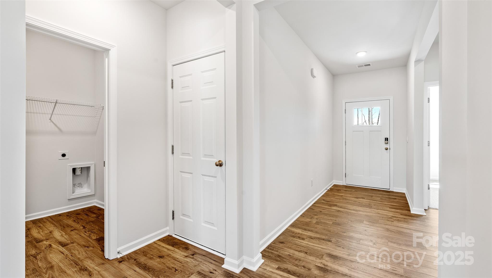 119 Bovine Br Road Fletcher, NC 28732 - Photo 15 of 29 a view of a hallway with wooden floor and a bathroom