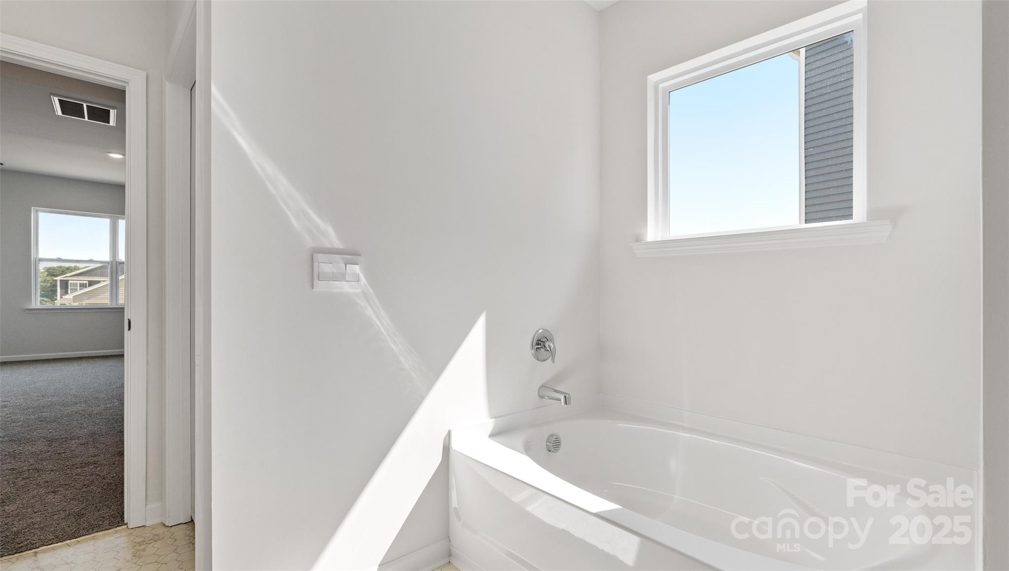 119 Bovine Br Road Fletcher, NC 28732 - Photo 22 of 29 a bathroom with bathtub and window