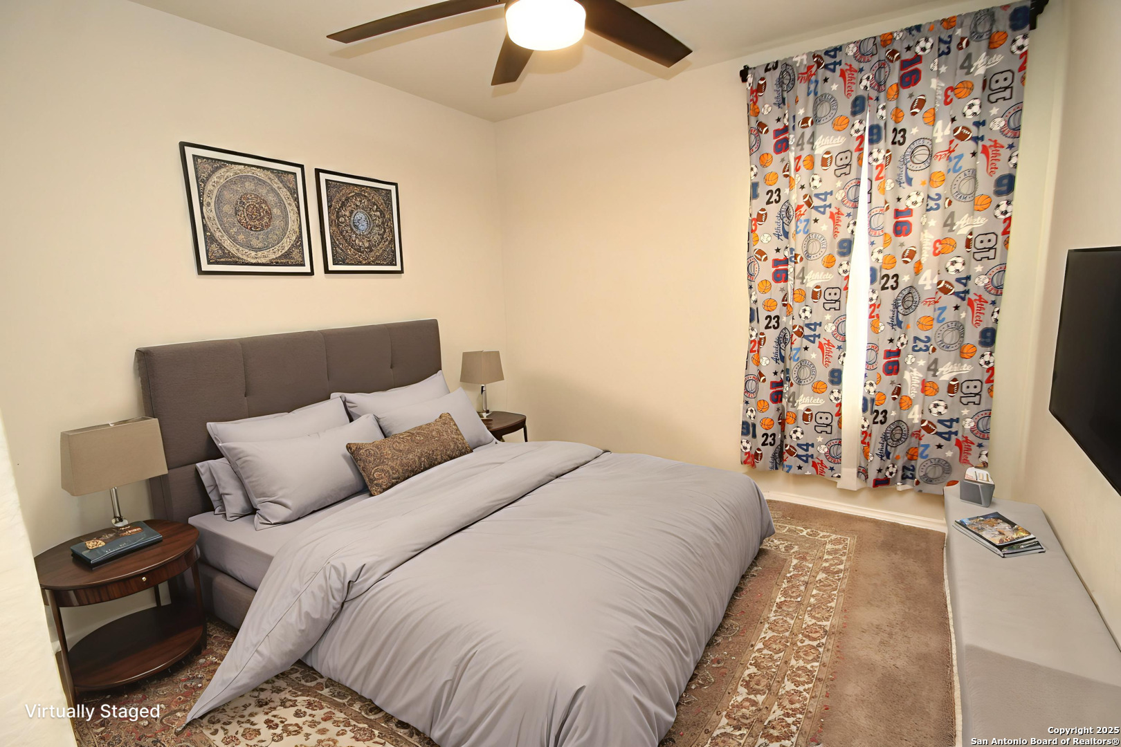 5859 Cielo Ranch San Antonio, TX 78218 - Photo 11 of 12 a bedroom with a bed and a chandelier