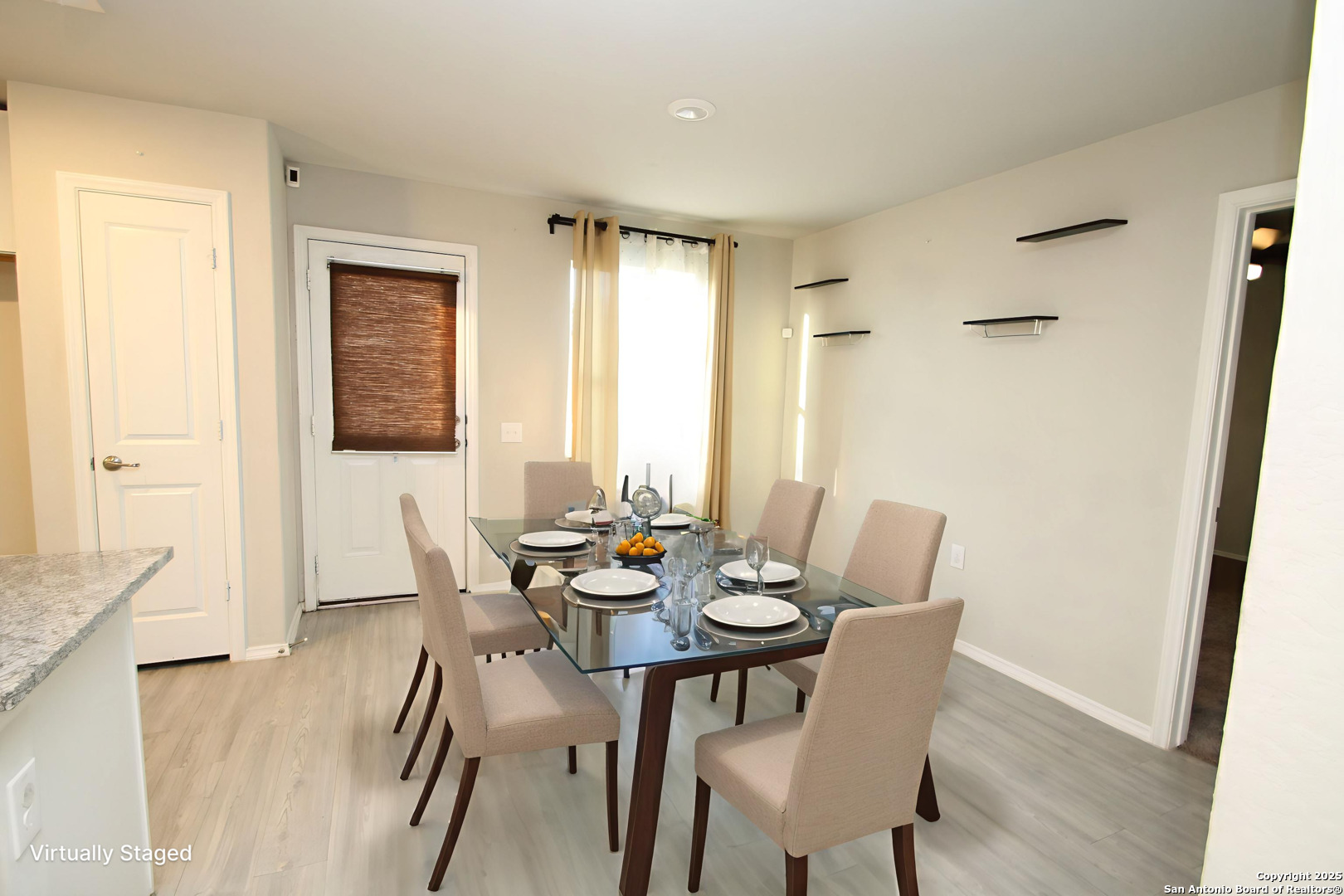 5859 Cielo Ranch San Antonio, TX 78218 - Photo 6 of 12 a view of a dining room with furniture and wooden floor