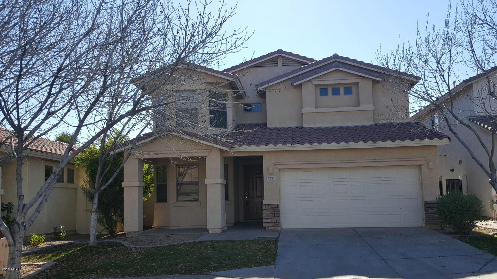 2711 East Carson Road Phoenix, AZ 85042 - Photo 1 of 1 a front view of a house with a yard and garage