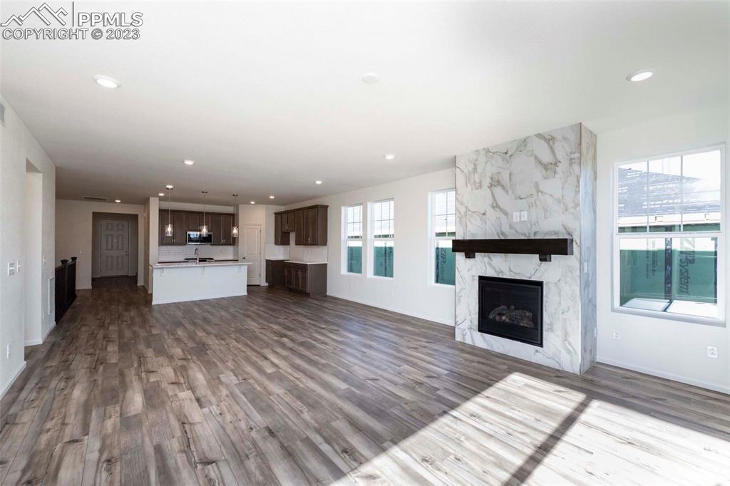 2057 Peachleaf Loop Castle Rock, CO 80108 - Photo 15 of 23 a living room with furniture and a fireplace