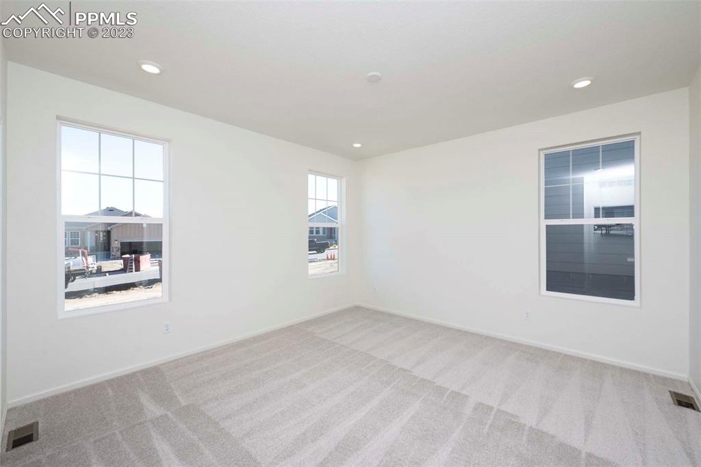 2057 Peachleaf Loop Castle Rock, CO 80108 - Photo 16 of 23 a view of an empty room with a window