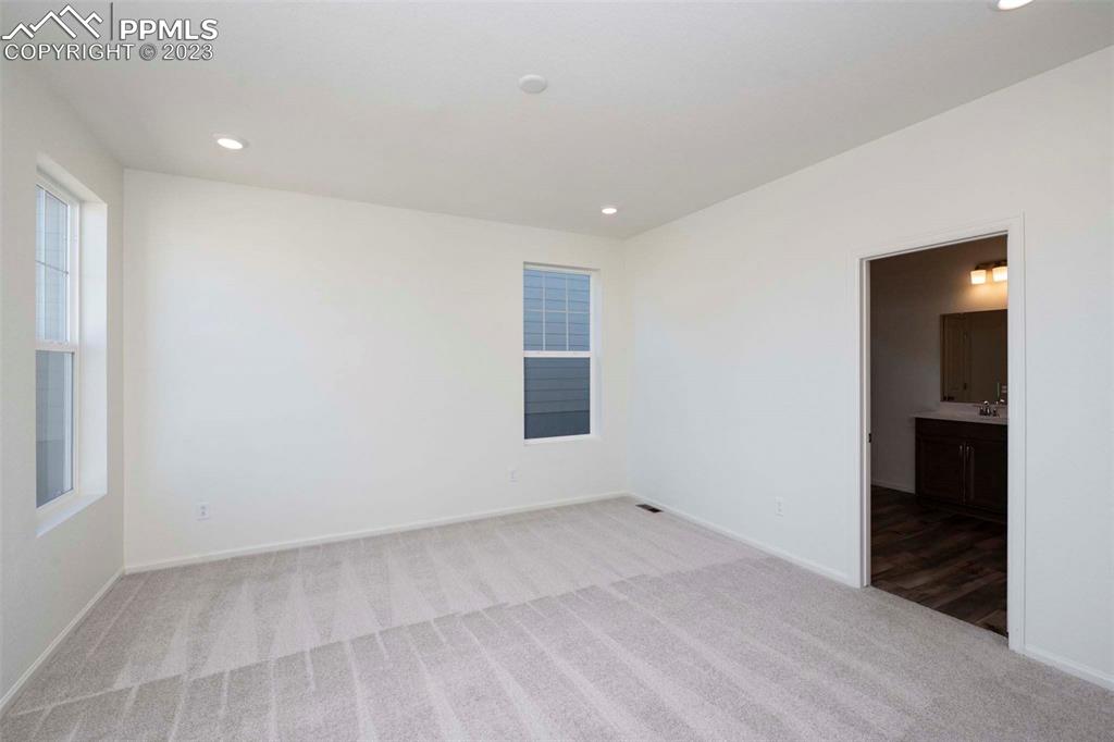 2057 Peachleaf Loop Castle Rock, CO 80108 - Photo 17 of 23 an empty room with windows
