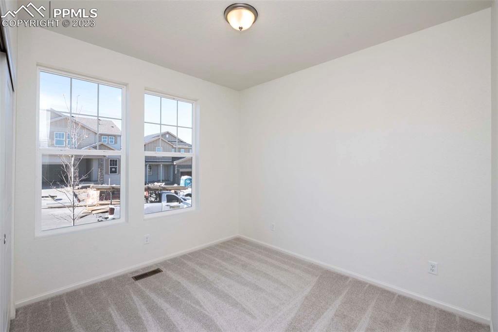 2057 Peachleaf Loop Castle Rock, CO 80108 - Photo 2 of 23 an empty room with windows