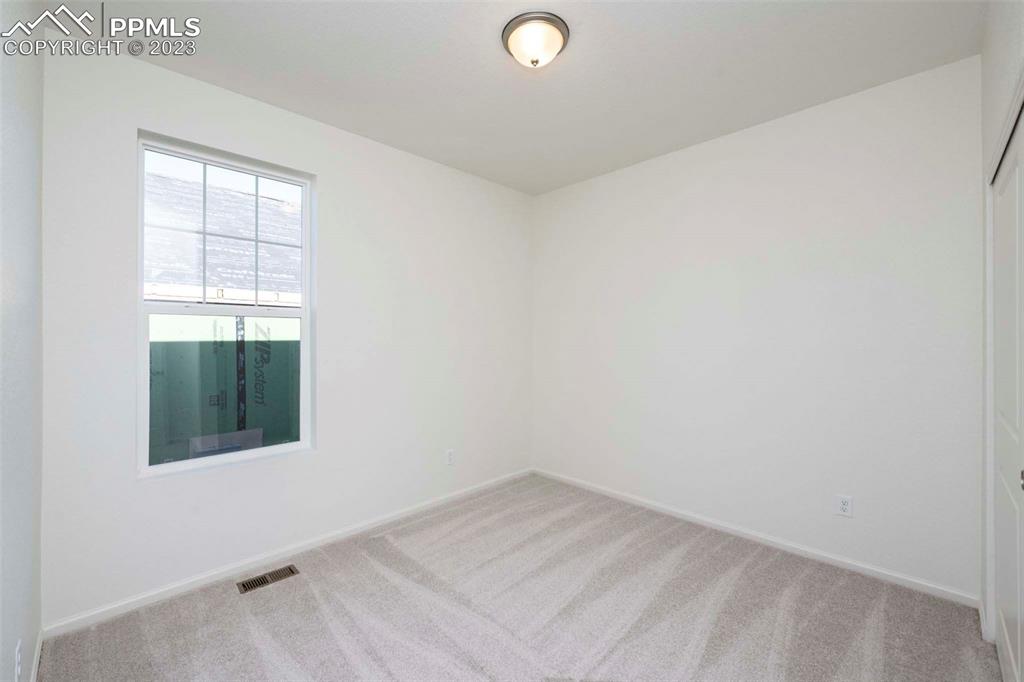 2057 Peachleaf Loop Castle Rock, CO 80108 - Photo 5 of 23 an empty room with a window