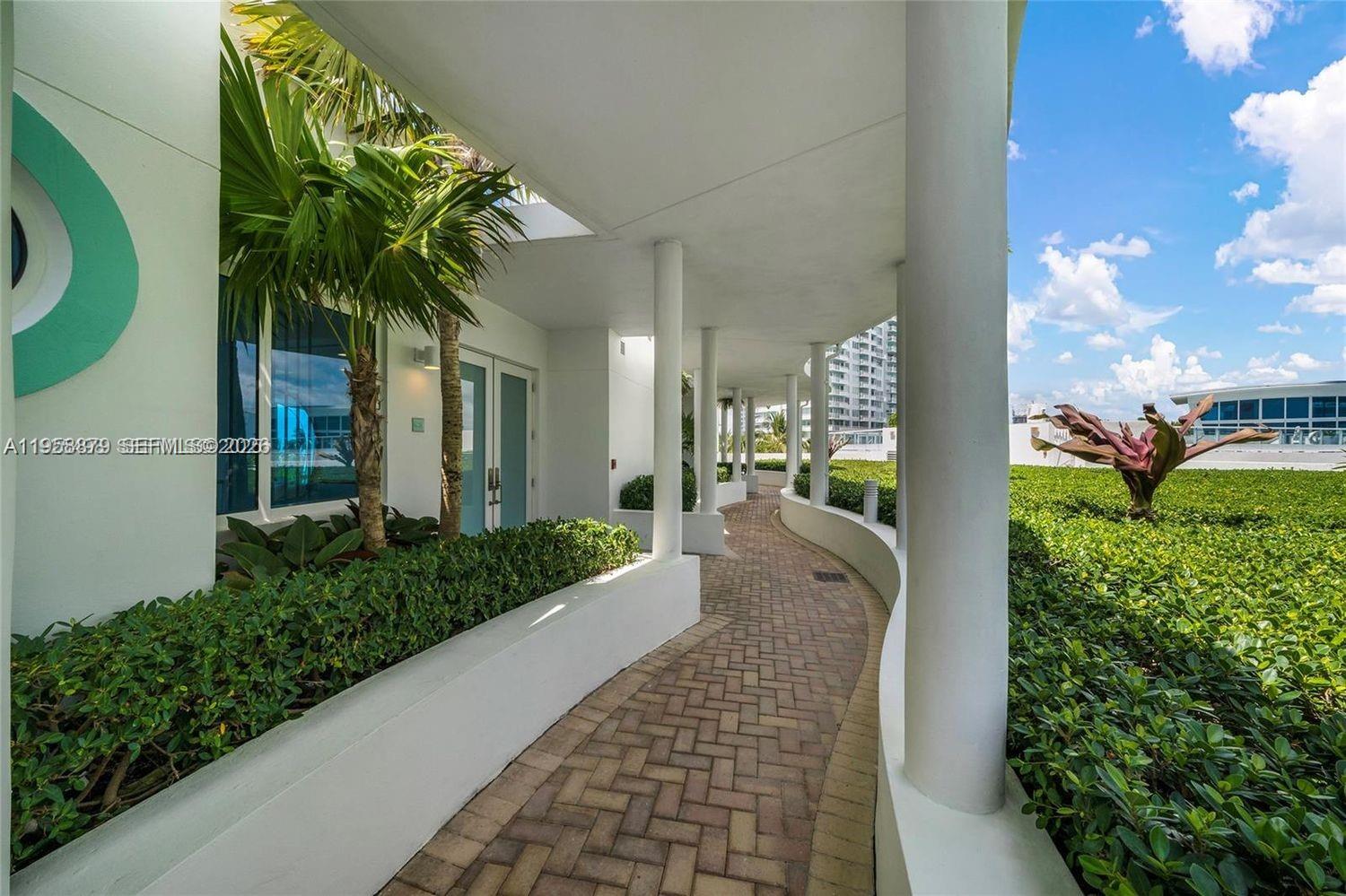100 South Pointe Drive, Unit TH13 Miami Beach, FL 33139 - Photo 17 of 69 a view of a house with a flower garden