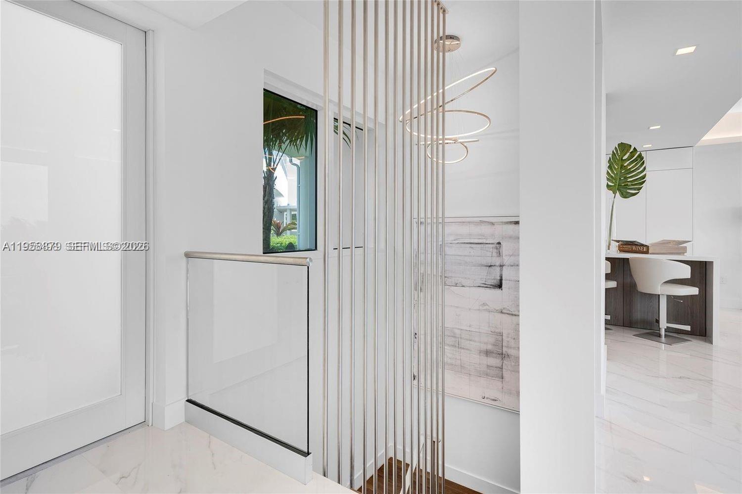100 South Pointe Drive, Unit TH13 Miami Beach, FL 33139 - Photo 20 of 69 a view of a hallway with wooden floor windows and entryway