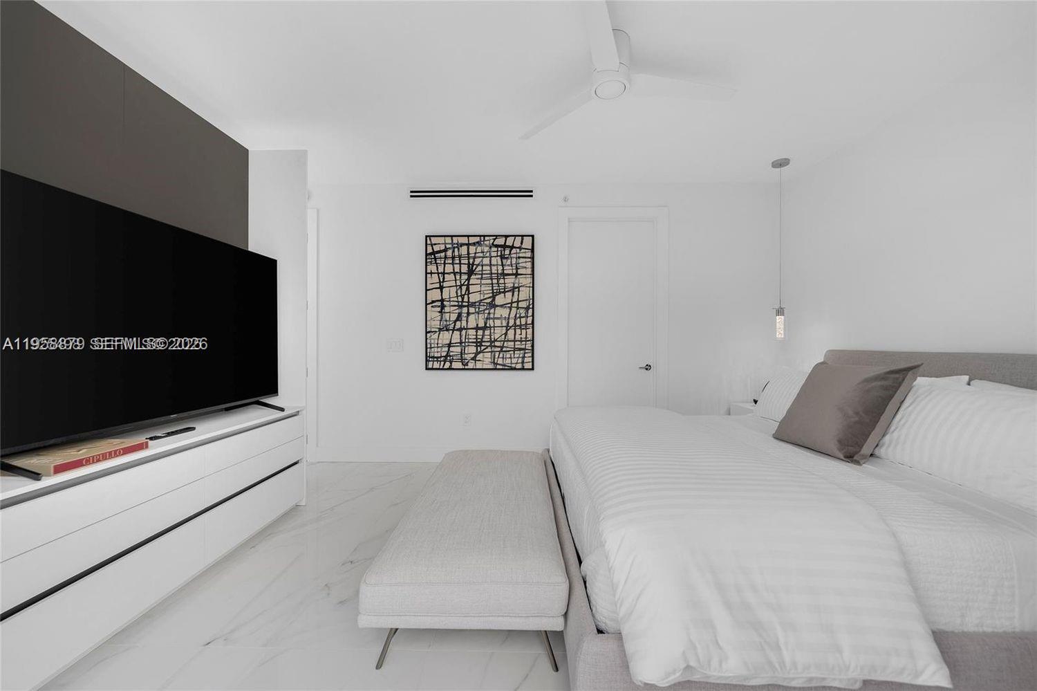 100 South Pointe Drive, Unit TH13 Miami Beach, FL 33139 - Photo 25 of 69 a bedroom with a bed and a flat screen tv