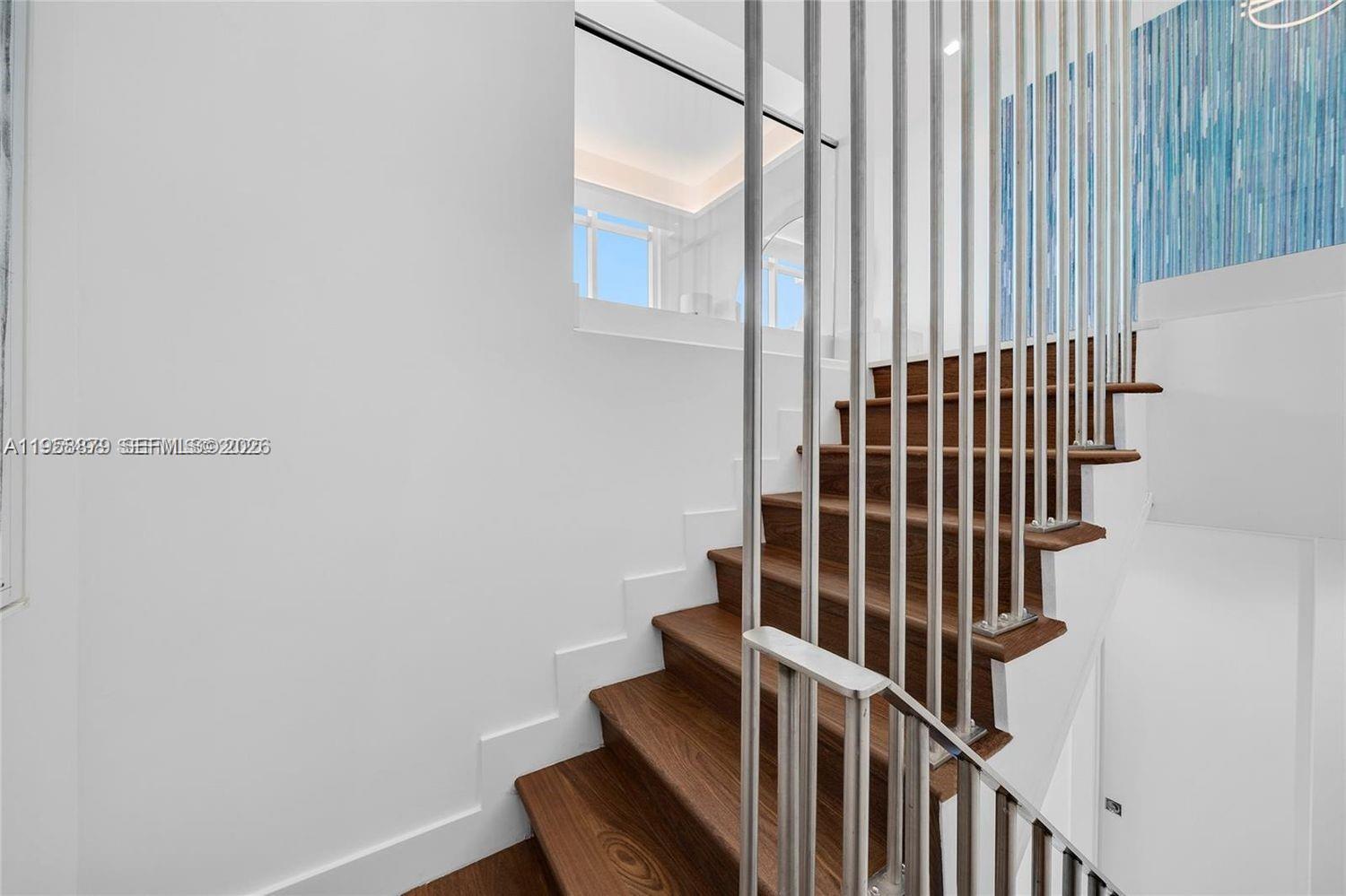 100 South Pointe Drive, Unit TH13 Miami Beach, FL 33139 - Photo 35 of 69 a view of staircase with railing and white walls
