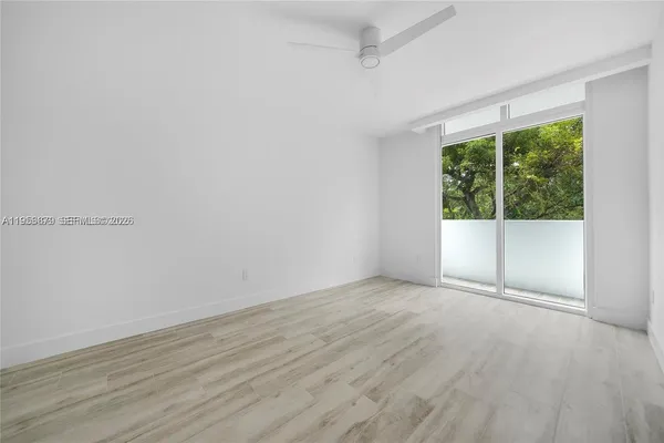 a view of an empty room with a fireplace