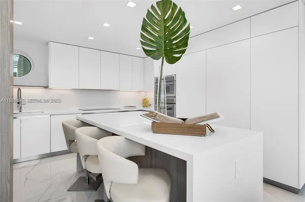 a kitchen with a sink cabinets and window