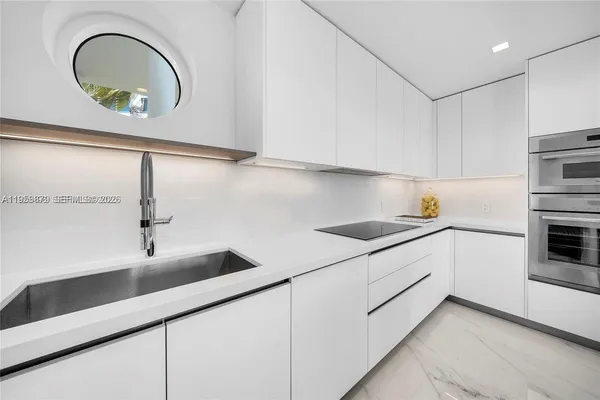 a kitchen with cabinets and appliances