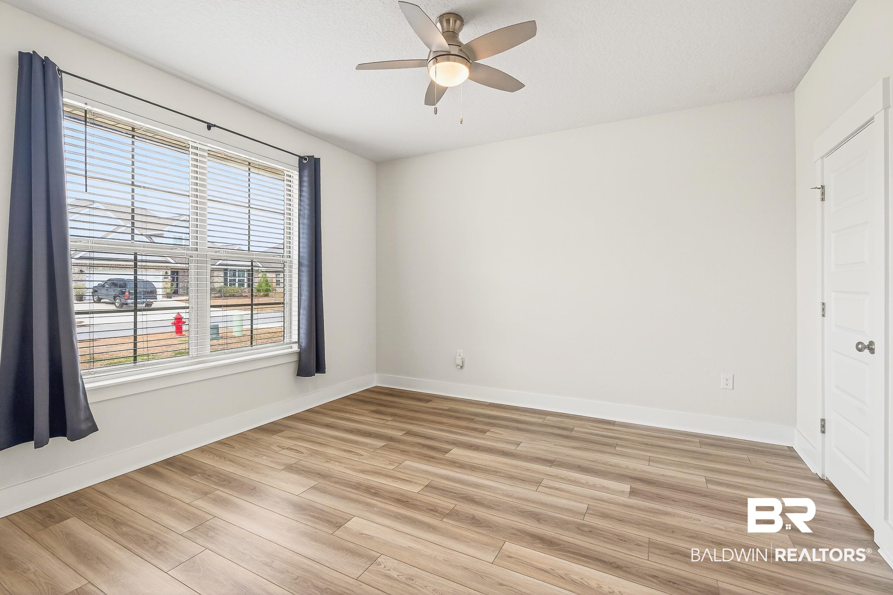 1728 Partridge Street Foley, AL 36535 - Photo 23 of 37 Unfurnished bedroom with light wood-type flooring and ceiling fan