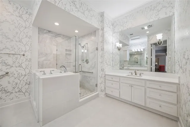 a large bathroom with a double vanity sink mirror and shower