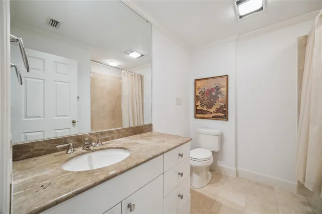 a spacious bedroom with two beds and a large window