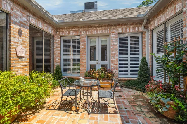 a backyard of a house with yard and outdoor seating