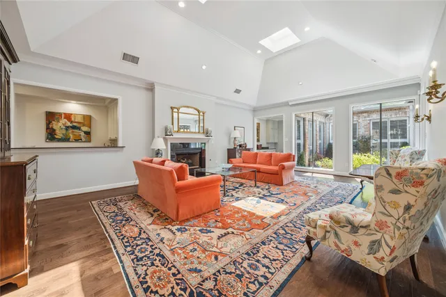a living room with furniture fireplace and a window