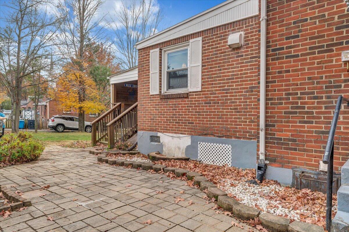 3116 Spring Road Southwest Roanoke, VA 24015 - Photo 20 of 22 a view of a brick house with a yard