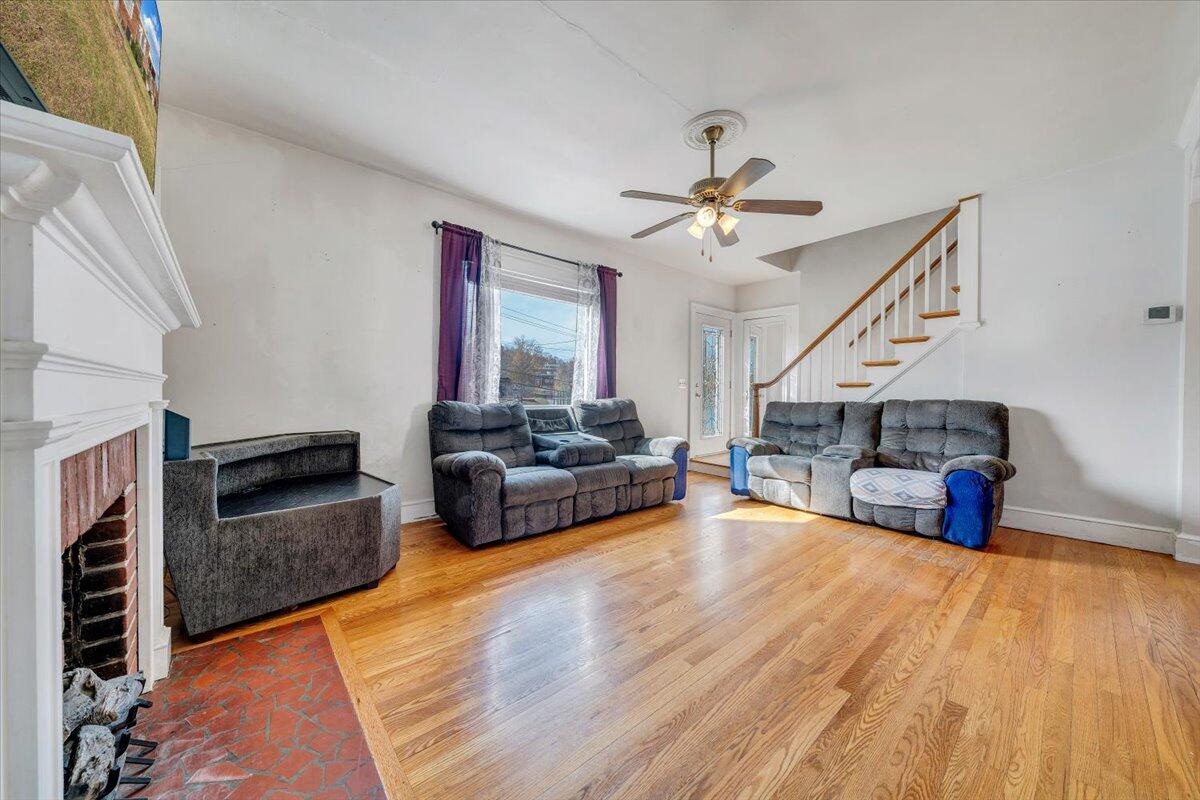 3116 Spring Road Southwest Roanoke, VA 24015 - Photo 3 of 22 a living room with furniture and a fireplace