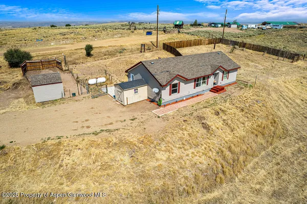 an aerial view of a house with a ocean view