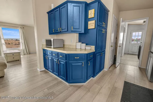 a kitchen with granite countertop a stove and cabinets