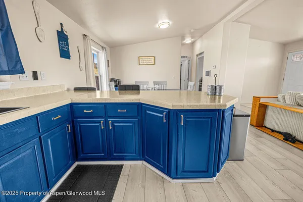 a kitchen with stainless steel appliances granite countertop wooden cabinets a stove and a sink