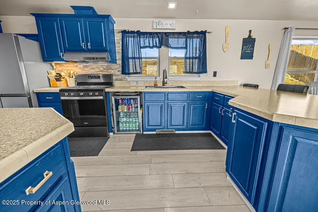 a living room with wooden floor and furniture