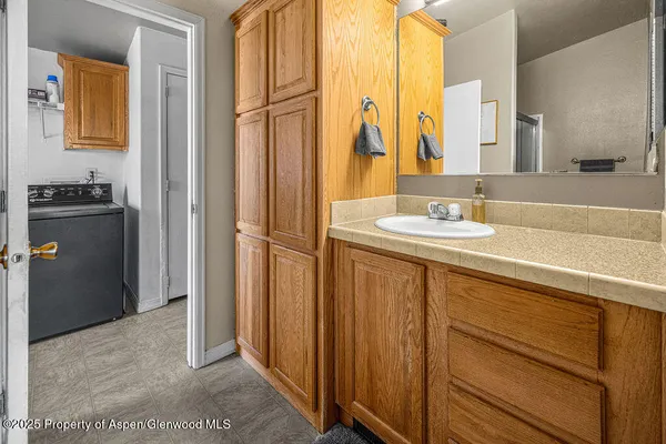 a view of a livingroom with furniture and a flat screen tv
