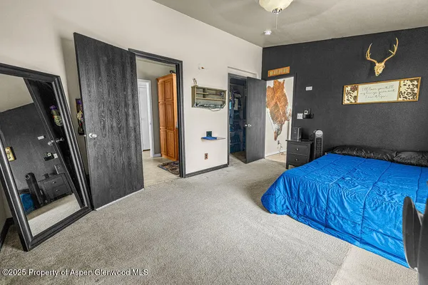 a view of a livingroom with furniture and a flat screen tv