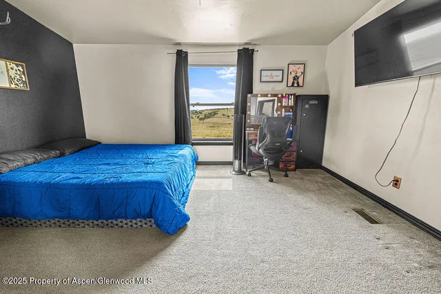 a view of room with window and wooden floor