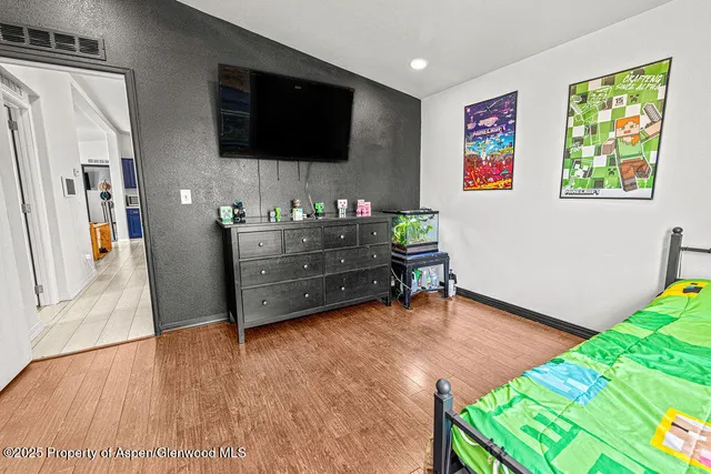 a bathroom with a sink a toilet a mirror and shower