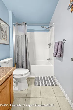 a bed room with a bed and a television