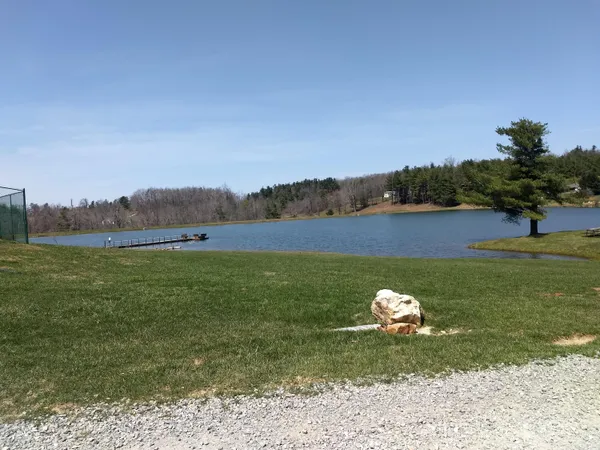 a view of a lake with a yard