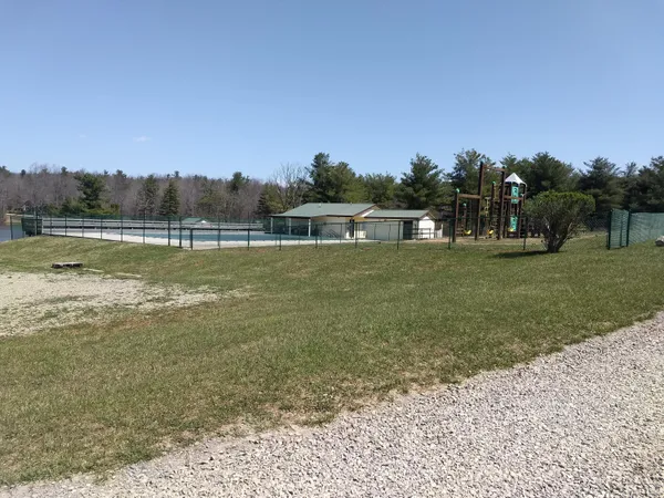 a view of a lake with houses in the back