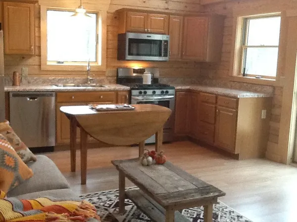 a kitchen with a sink cabinets and window