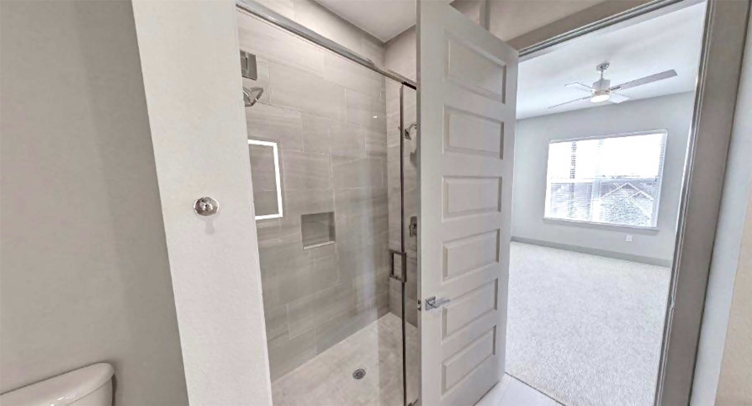 401 West 25th Street, Unit 1144 Houston, TX 77008 - Photo 16 of 42 a bathroom with a glass shower door