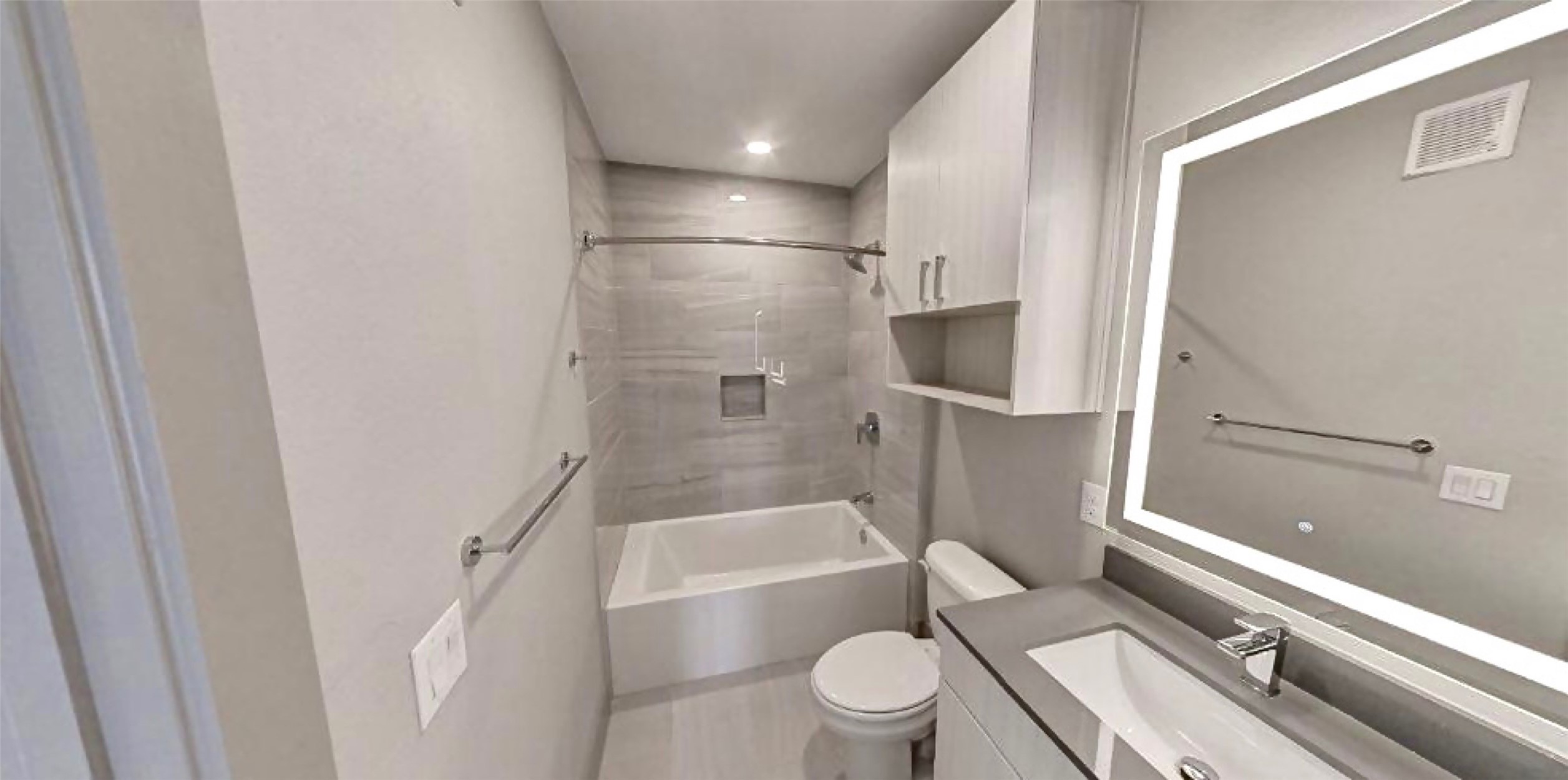 401 West 25th Street, Unit 1144 Houston, TX 77008 - Photo 17 of 42 a bathroom with a granite countertop bathtub shower sink vanity mirror and toilet
