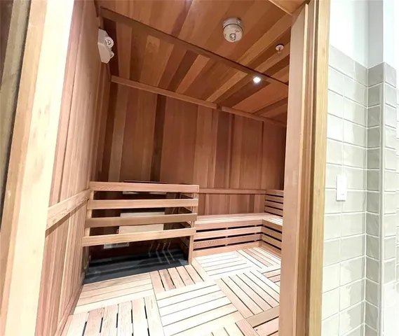 a view of a room with stairs and a window