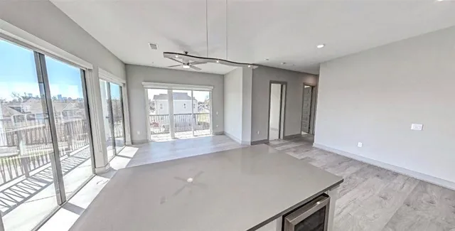 a view of a room with large windows