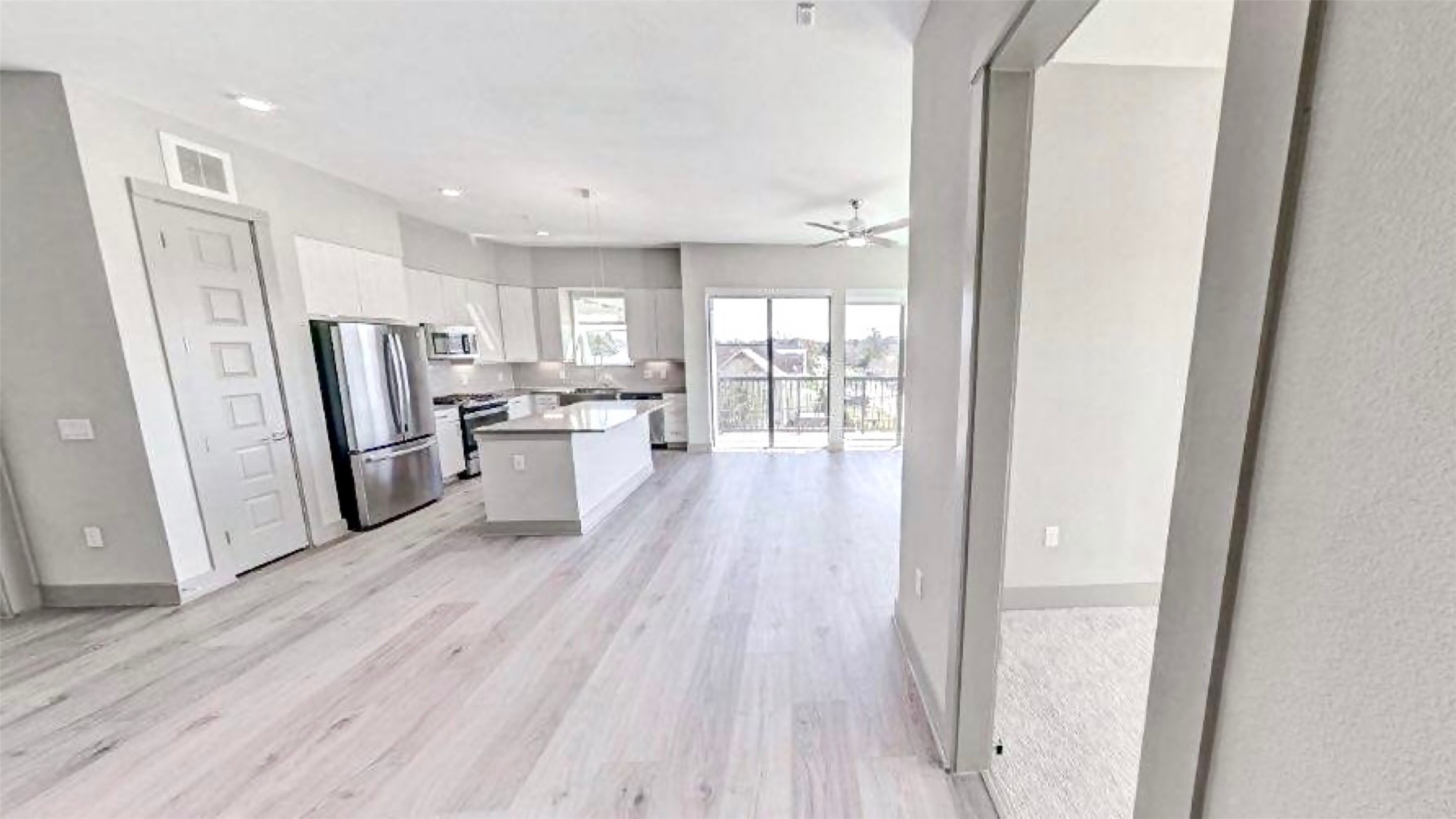 401 West 25th Street, Unit 1144 Houston, TX 77008 - Photo 6 of 42 a kitchen with a refrigerator a sink and cabinets