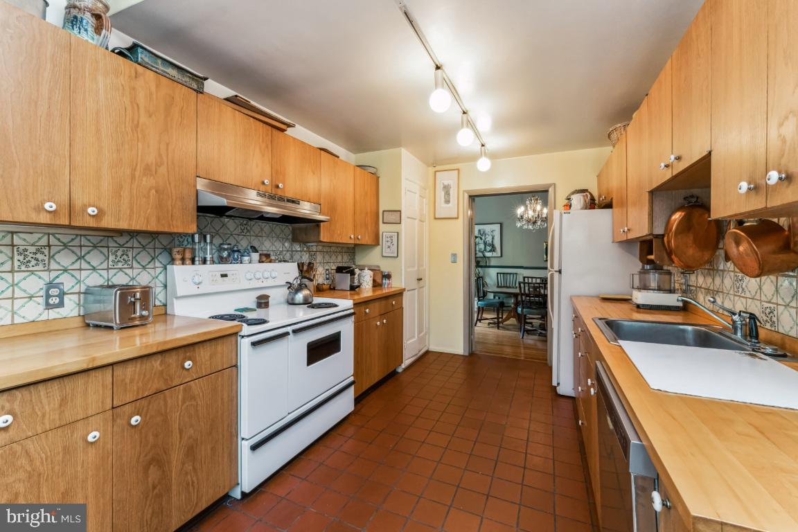 1807 Kenway Road Baltimore, MD 21209 - Photo 15 of 54 a kitchen with a sink stove and cabinets