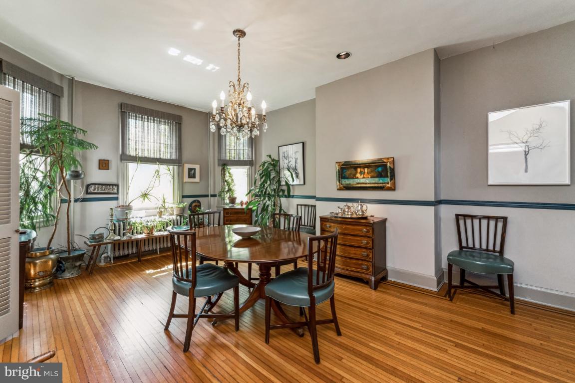 1807 Kenway Road Baltimore, MD 21209 - Photo 16 of 54 a view of a dining room with furniture and wooden floor