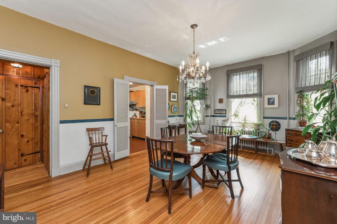 1807 Kenway Road Baltimore, MD 21209 - Photo 17 of 54 a view of a dining room with furniture and wooden floor